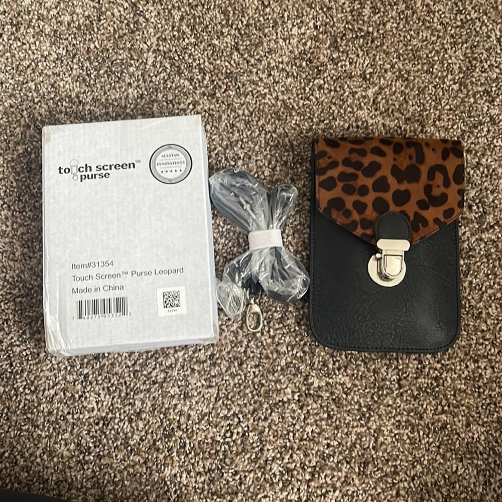 Brand new Leopard touch screen purse.